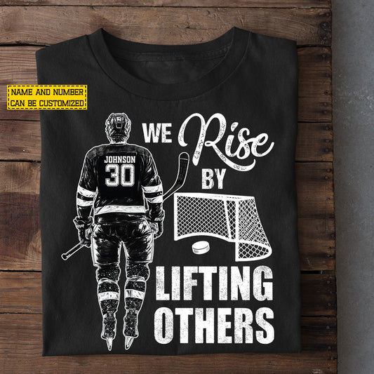 Personalized Hockey Man T-shirt, We Rise By Lifting Others Sport Tees Gift For Hockey Lover