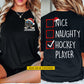 Personalized Christmas Hockey Two-sided T-shirt, Nice Naughty Hockey Player Sports Tees Spooky Season Gift For Hockey Lovers